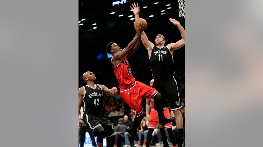 5be561e3-Bulls Nets Basketball