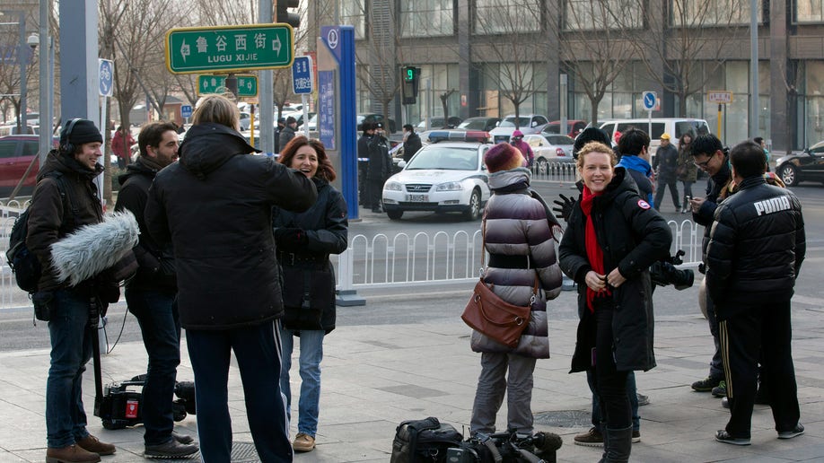 987cec49-China Journalists Under Pressure