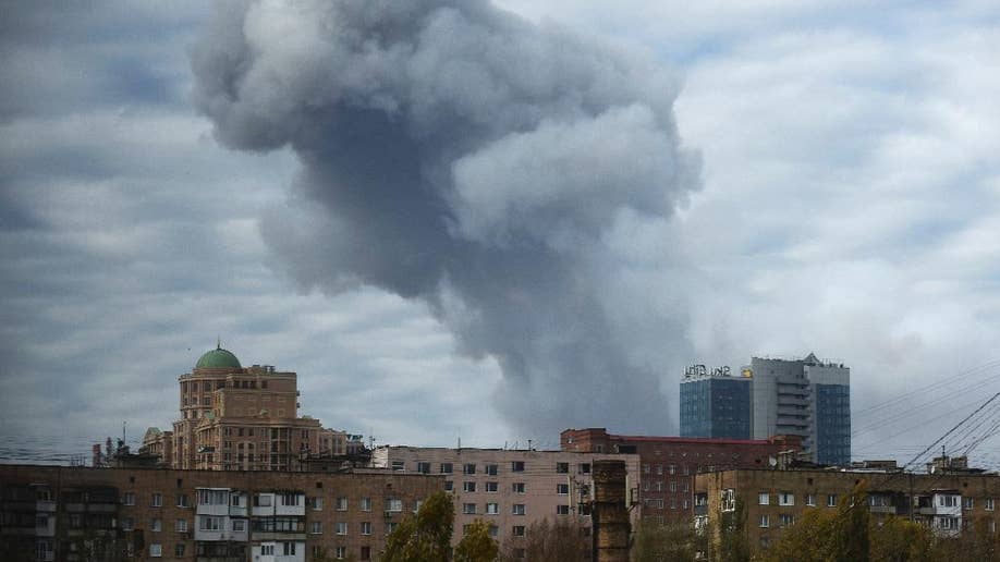 Explosion Rocks Rebel-held Ukrainian City As Fighters Ignore Cease-fire ...