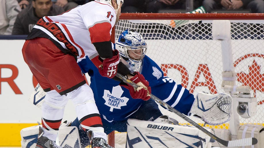 b581420a-Hurricanes Maple Leafs Hockey