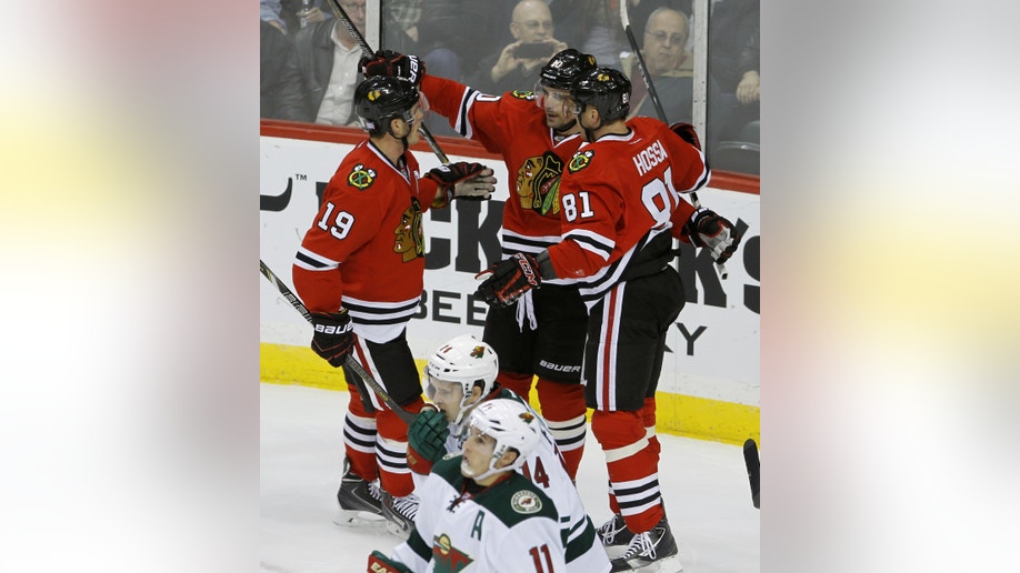 e3486bbe-Blackhawks Wild Hockey