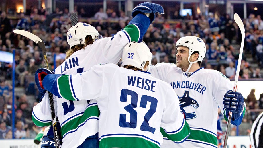 68da4e9c-Canucks Oilers Hockey