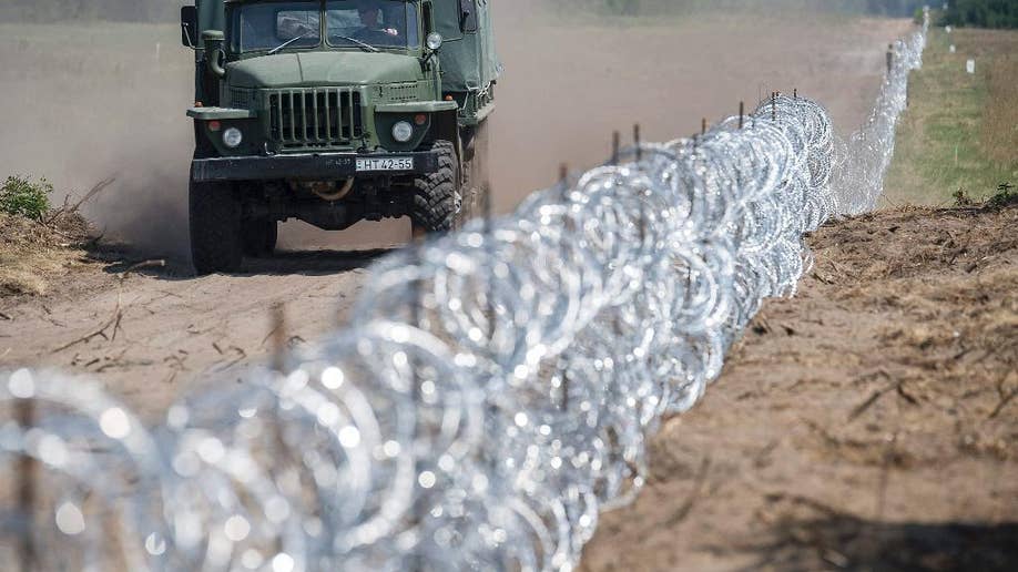 Hungarys Government Party Wants Exemplary Punishment For Migrants Cutting Border Fence Fox News 