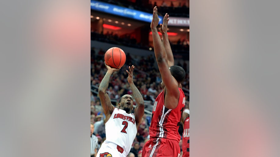 f191a523-W Kentucky Louisville Basketball