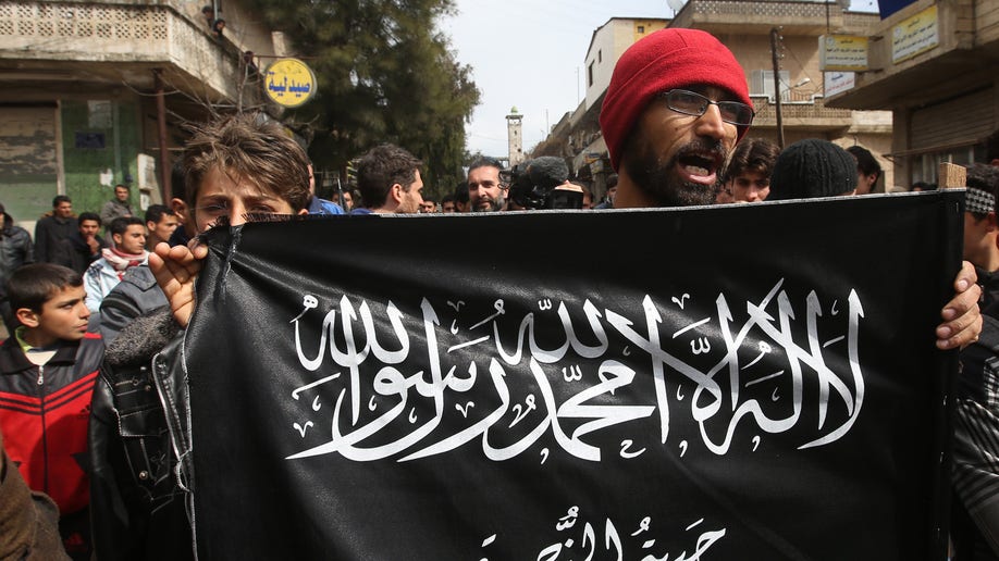 Elusive Head Of Al Qaeda-linked Group Fights Syrian Regime From Shadows ...