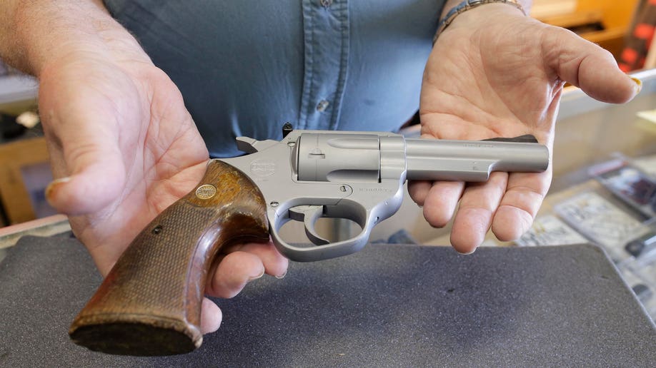 79db9822-LAPD Revenge Killings Gun Auction