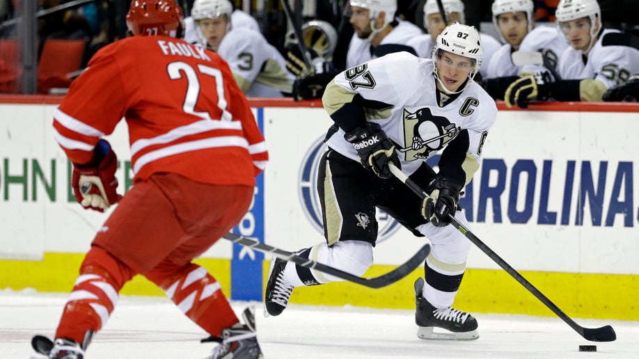 9c4c05c9-Penguins Hurricanes Hockey