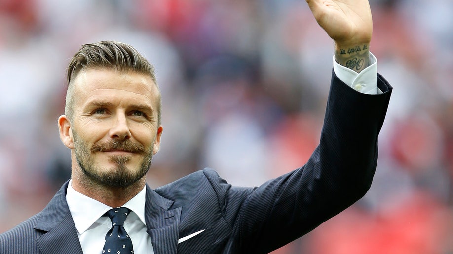 8eda3cca-Beckham Retires Soccer