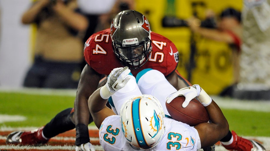 a5711c62-Dolphins Buccaneers Football