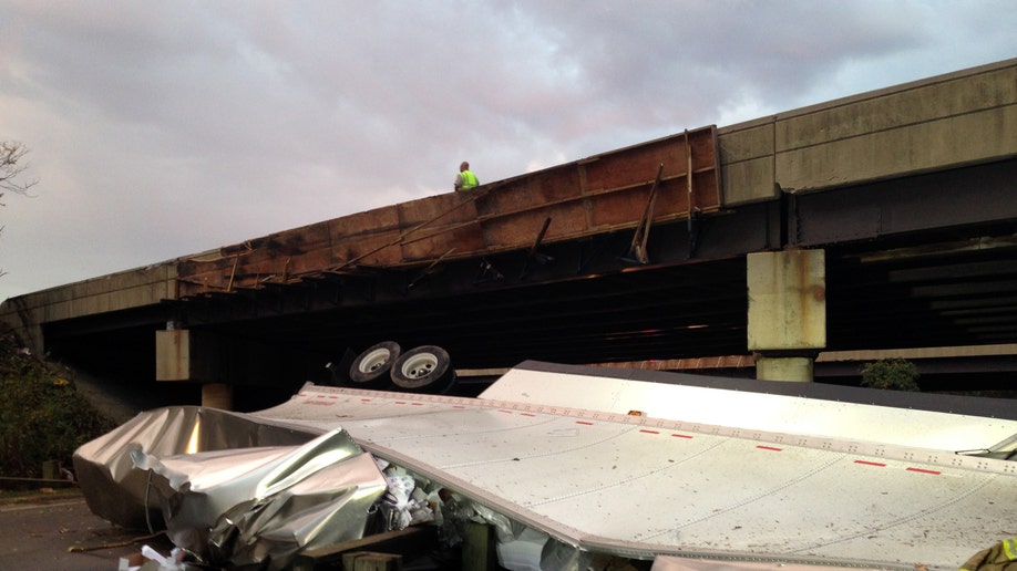 truck plunges off overpass