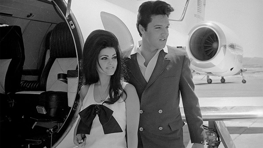 Newlyweds Elvis and Priscilla Presley, who met while Elvis was in the Army, prepare to board their private jet following their wedding at the Aladdin Resort and Casino in Las Vegas.
