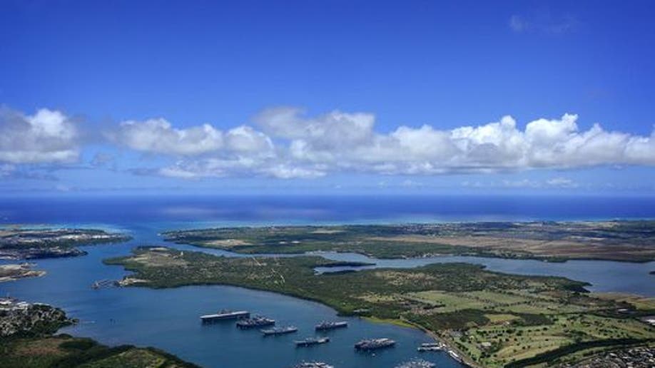 Navy ships are anchored in the waters of Joint Base Pearl Harbor-Hickam on July 14, 2011, at the entrance to the Pacific Ocean. (Credit: MC2 Daniel Barker/Navy)