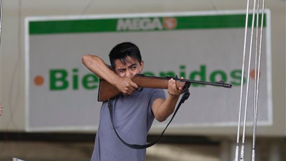 1c4b9996-APTOPIX Mexico Tropical Weather