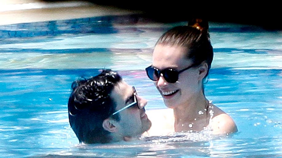 ab0aeb73-Joe Jonas and Blanda Eggenschwiler relax in the pool
