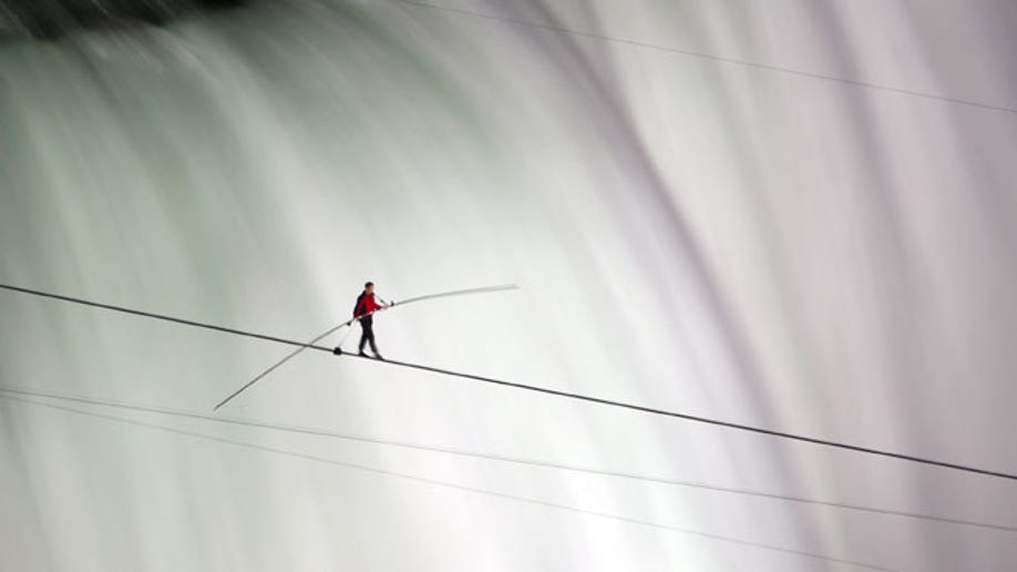 Man Tightrope Walking Over River Old Photo