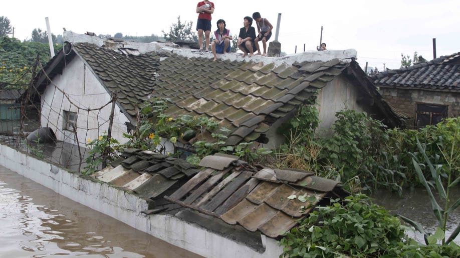 5949c718-North Korea Flood Damage