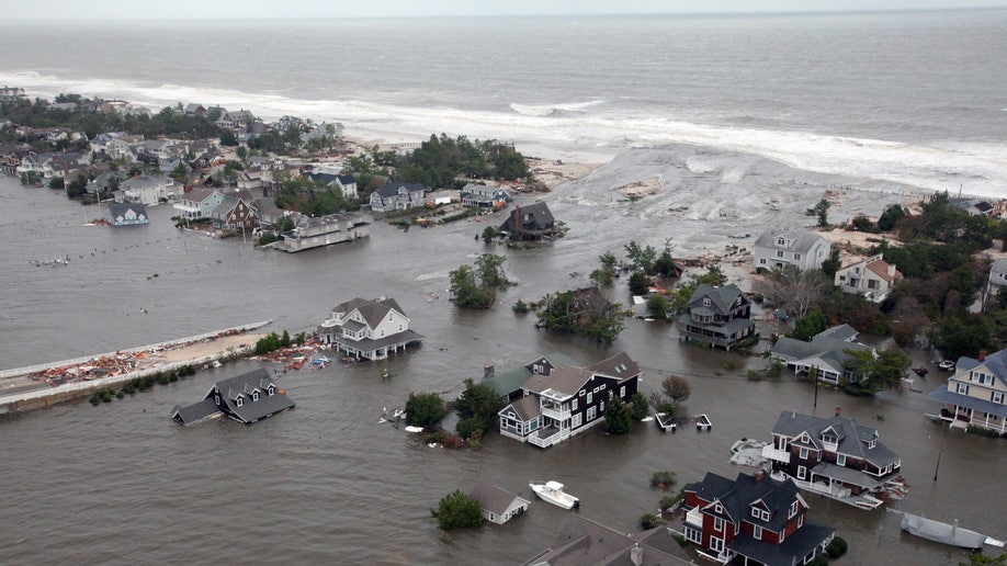 This Oct. 30, 2012 aerial photo provided by the U.S.Air Force shows flooding on the New Jersey shoreline during a search and rescue mission by 1-150 Assault Helicopter Battalion, New Jersey Army National Guard. By late Tuesday, the winds and flooding inflicted by the fast-weakening Superstorm Sandy had subsided, leaving at least 55 people dead along the Atlantic Coast and splintering beachfront homes and boardwalks from the mid-Atlantic states to southern New England. (AP Photo/U.S. Air Force, Master Sgt. Mark C. Olsen)