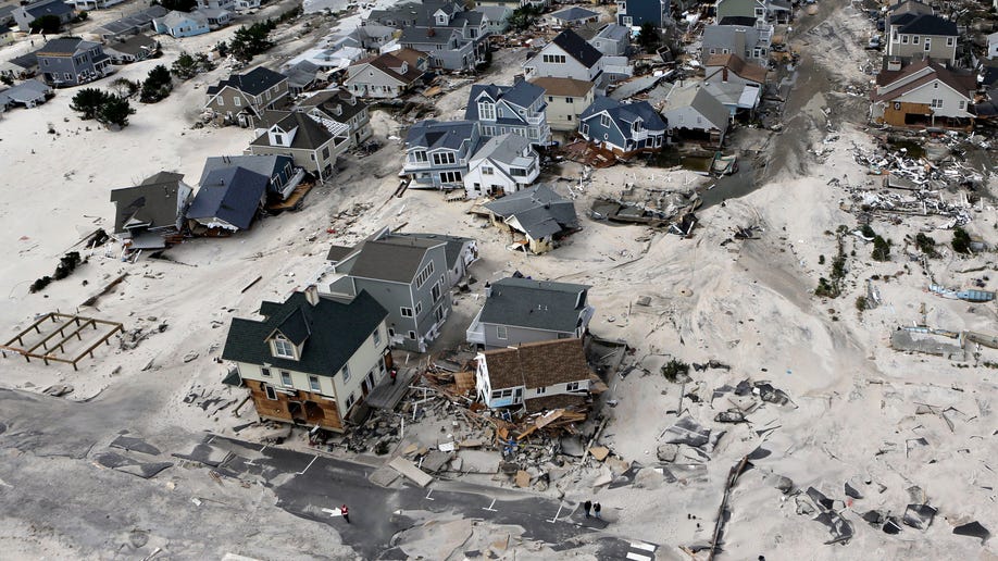 This aerial photo shows the destroyed homes left in the wake of superstorm Sandy on Wednesday, Oct. 31, 2012, in Seaside Heights, N.J. New Jersey got the brunt of Sandy, which made landfall in the state and killed six people. More than 2 million customers were without power as of Wednesday afternoon, down from a peak of 2.7 million. (AP Photo/Mike Groll)