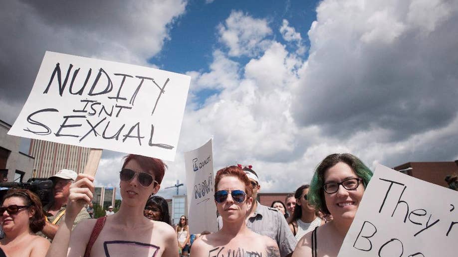 Topless protest in Canada urges women to 'bare with us' after pol...