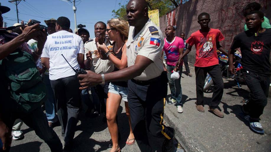 Thousands of Haitian protesters decry violence against countrymen in