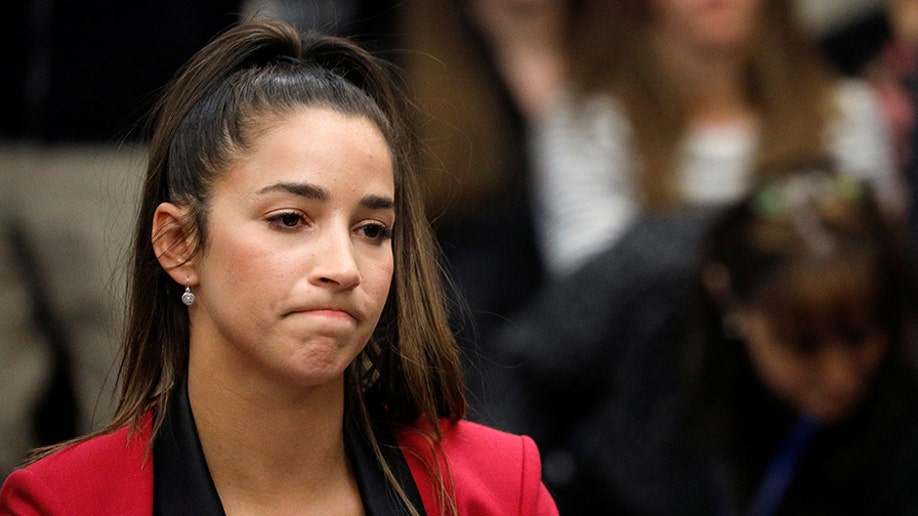 Victim and former gymnast Aly Raisman appears before speaking at the sentencing hearing for Larry Nassar, a former team USA Gymnastics doctor who pleaded guilty in November 2017 to sexual assault charges, in Lansing, Michigan, U.S., January 19, 2018. REUTERS/Brendan McDermid - RC1BC6363FB0