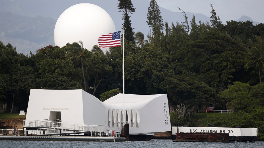 FILE - In this Dec. 27, 2016, file photo, USS Arizona Memorial, part of the World War II Valor in the Pacific National Monument, at Joint Base Pearl Harbor-Hickam, Hawaii. The National Park Service is working as fast as possible to reopen access to the USS Arizona Memorial after cracks were discovered last month on the floating concrete pier near the metal access ramp, officials said. Visitors to the memorial at Pearl Harbor in Honolulu are taken on a 15-minute narrated tour of Battleship Row instead of the usual docking at the site, the Honolulu Star-Advertiser reported Friday, June 8, 2018. (AP Photo/Carolyn Kaster, File)