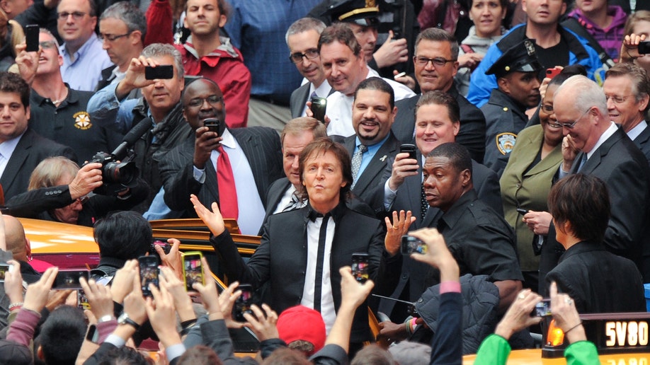 APTOPIX Paul McCartney Surprise Times Square Concert
