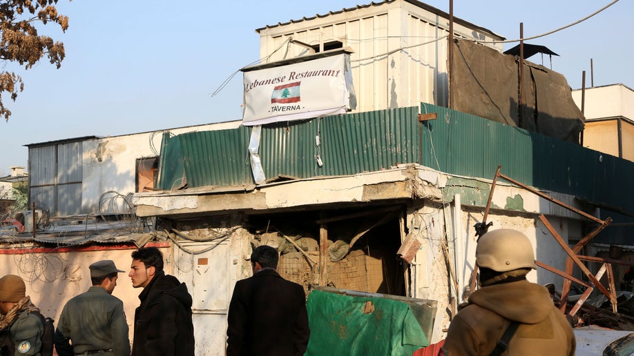 Afghan police say death toll in attack on Kabul restaurant rises to 21