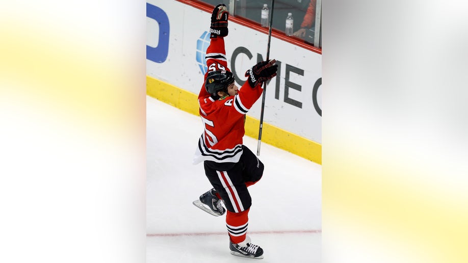 18059a27-Oilers Blackhawks Hockey