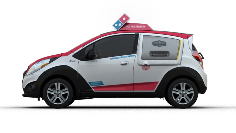 47ba5945-Dominou2019s announced today it has chosen the 2015 Chevrolet Spark as the basis for the companyu2019s new Dominou2019s DXP ™(Delivery Expert).