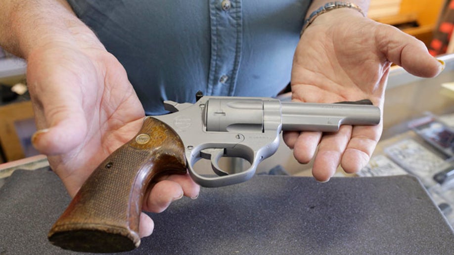 6ac02369-LAPD Revenge Killings Gun Auction