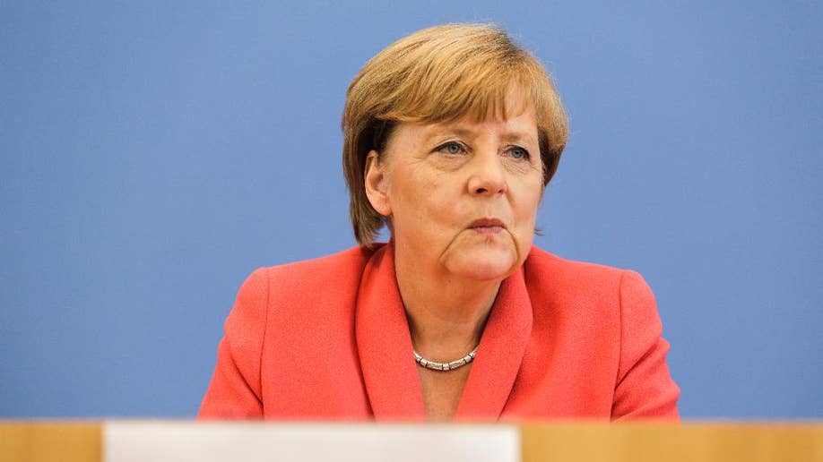 Germany S Merkel Presses For Other Eu Countries To Do More To Share