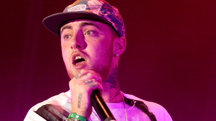 FILE - In this July 13, 2013 file photo, rapper Mac Miller performs on his Space Migration Tour at Festival Pier in Philadelphia. Miller, the platinum hip-hop star whose rhymes vacillated from party raps to lyrics about depression and drug use, has died at the age of 26. A family statement released through his publicists says Miller died Friday, Sept. 7, 2018, and there are no further details available on how he died. (Photo by Owen Sweeney/Invision/AP, File)