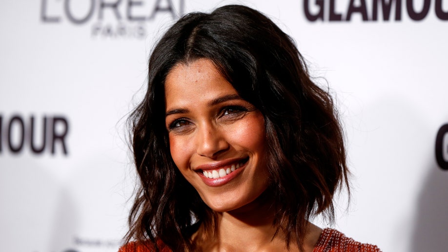 Actress Freida Pinto arrives for Glamour Magazine's annual Women of the Year award ceremony in New York November 10, 2014. REUTERS/Lucas Jackson (UNITED STATES - Tags: ENTERTAINMENT) - RTR4DNMC