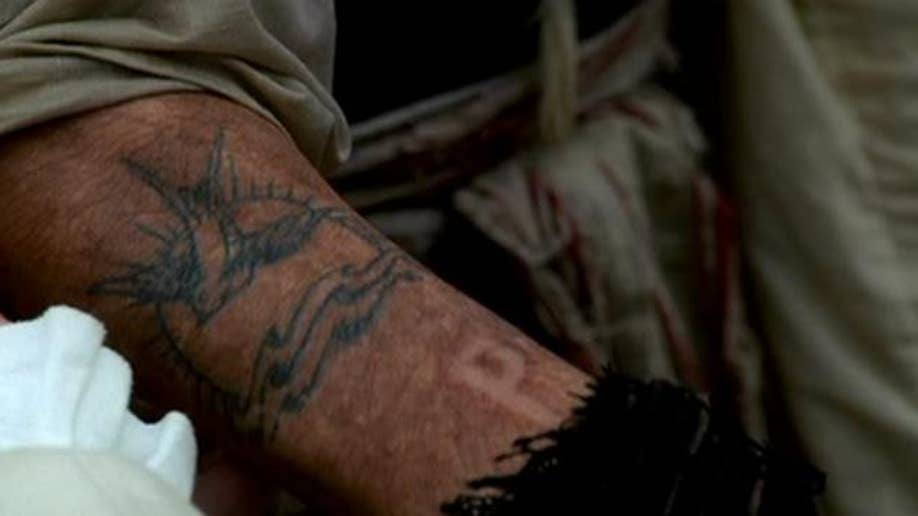 norman reedus tattoo on wrist
