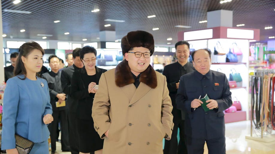 North Korean leader Kim Jong Un, together with his wife Ri Sol Ju (L), gives field guidance at the newly built Mirae Shop and Health Complex in this undated photo released by North Korea's Korean Central News Agency (KCNA) on March 28, 2016. REUTERS/KCNA ATTENTION EDITORS - THIS PICTURE WAS PROVIDED BY A THIRD PARTY. REUTERS IS UNABLE TO INDEPENDENTLY VERIFY THE AUTHENTICITY, CONTENT, LOCATION OR DATE OF THIS IMAGE. FOR EDITORIAL USE ONLY. NOT FOR SALE FOR MARKETING OR ADVERTISING CAMPAIGNS. THIS PICTURE IS DISTRIBUTED EXACTLY AS RECEIVED BY REUTERS, AS A SERVICE TO CLIENTS. NO THIRD PARTY SALES. SOUTH KOREA OUT. NO COMMERCIAL OR EDITORIAL SALES IN SOUTH KOREA - RTSCGN9