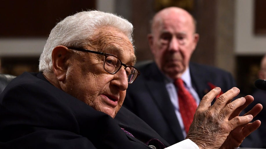 Former Secretary of State Henry Kissinger, left, speaks during the Senate Armed Services Committee hearing on Capitol Hill in Washington, Thursday, Jan. 25, 2018, on global challenges and U.S. national security strategy. Kissinger testified at the hearing along with former Secretary of State George Shultz, right, and former Deputy Secretary of State Richard Armitage. (WHD Photo/Susan Walsh)