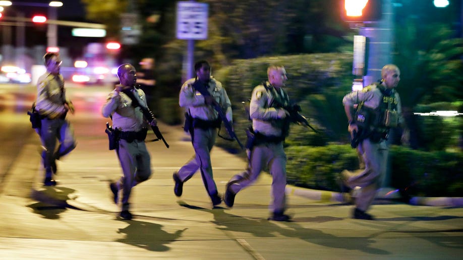 Police in Las Vegas running for cover during mass shooting