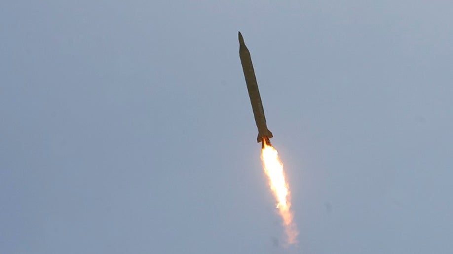 EDITORS' NOTE: Reuters and other foreign media are subject to Iranian restrictions on their ability to film or take pictures in Tehran.A Ghadr 1 class Shahab 3 long range missile is launched during a test from an unknown location in central Iran September 28, 2009. Iran test-fired the missile on Monday which defence analysts have said could hit Israel and U.S. bases in the Gulf, state media reported, a move that may irk world powers ahead of rare talks with Tehran this week. REUTERS/Fars News/Ali Shayegan (IRAN MILITARY POLITICS) QUALITY FROM SOURCE - GM1E59S1FIM01