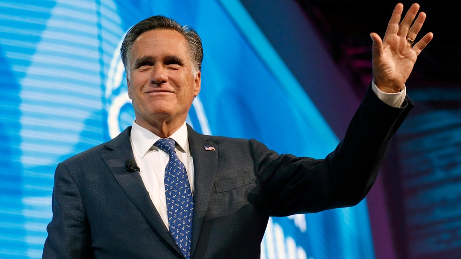 Former Republican presidential candidate Mitt Romney waves after speaking about the tech sector during an industry conference dubbed Silicon Slopes, the nickname for Utah's burgeoning cluster of tech companies Friday, Jan. 19, 2018, in Salt Lake City. Those close to the 70-year-old say he's interested in running for the Utah Senate seat being vacated by Republican Orrin Hatch and expect an announcement soon, though Romney has demurred so far. (AP Photo/Rick Bowmer)