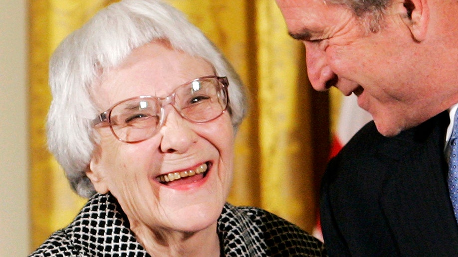 U.S. President George W. Bush (R) before awarding the Presidential Medal of Freedom to American novelist Harper Lee (L) in the East Room of the White House, in this November 5, 2007, file photo. Lee, who wrote one of America's most enduring literary classics, "To Kill a Mockingbird," about a child's view of right and wrong and waited 55 years to publish a second book with the same characters from a very different point of view, has died at the age of 89, local Alabama news site reported on February 19, 2016. REUTERS/Larry Downing/Files - RTX27QLX