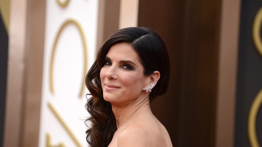 FILE - In this March 2, 2014 file photo, Sandra Bullock arrives at the Oscars at the Dolby Theatre, in Los Angeles. Bullock's ordeal of waking up with a man inside her home in June 2014 comes to life in 911 call audio and copies of the man's writings about the actress revealed in a court hearing on Thursday released by the Los Angeles Superior Court Friday, April 10, 2015. (Photo by Jordan Strauss/Invision/AP, File)