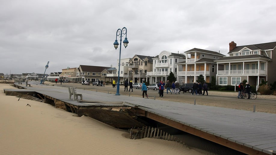 This photo made available by the New Jersey Governor's Office shows damage to the boardwalk in Belmar, N.J. on Tuesday, Oct. 30, 2012 after superstorm Sandy made landfall in New Jersey Monday evening. (AP Photo/New Jersey Governor's Office, Tim Larsen)