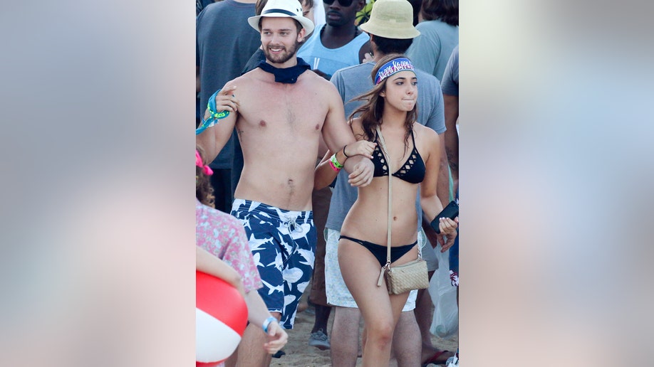299fb84c-EXCLUSIVE: **PREMIUM RATES APPLY** Patrick Schwarzenegger spends time in a Irish Bar for spring break in Cabo, surrounded by pretty girls