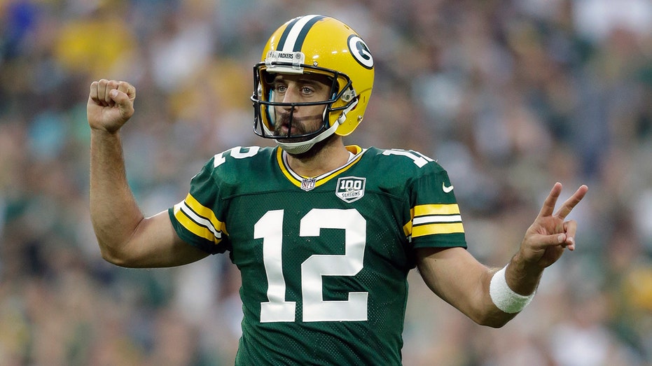 Green Bay Packers' Aaron Rodgers smacks back after beer chugging