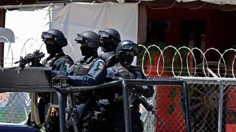 Mexican Police Investigate Mass Graves