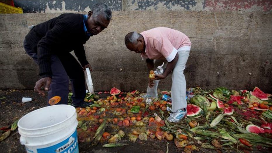 Venezuelans pick through trash for food to eat or sell