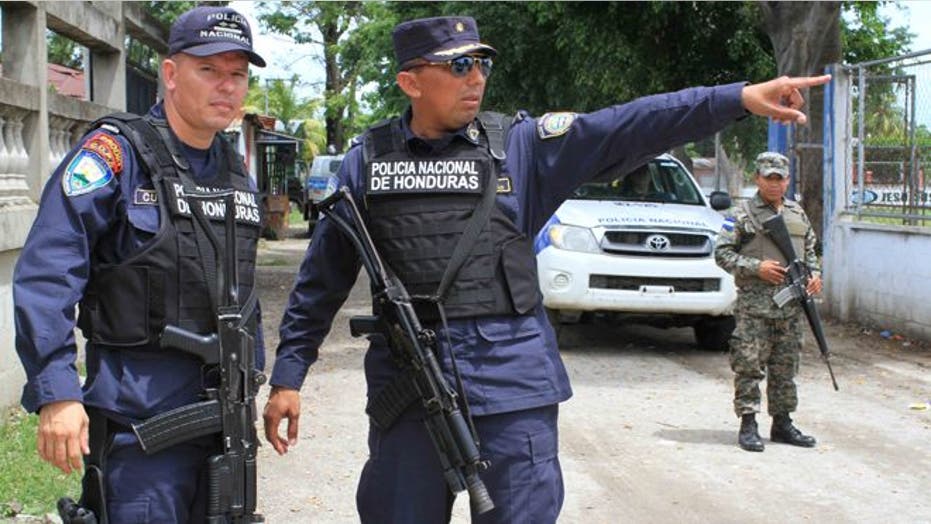A look at how police patrol, and people live in, a country torn apart by gang wars