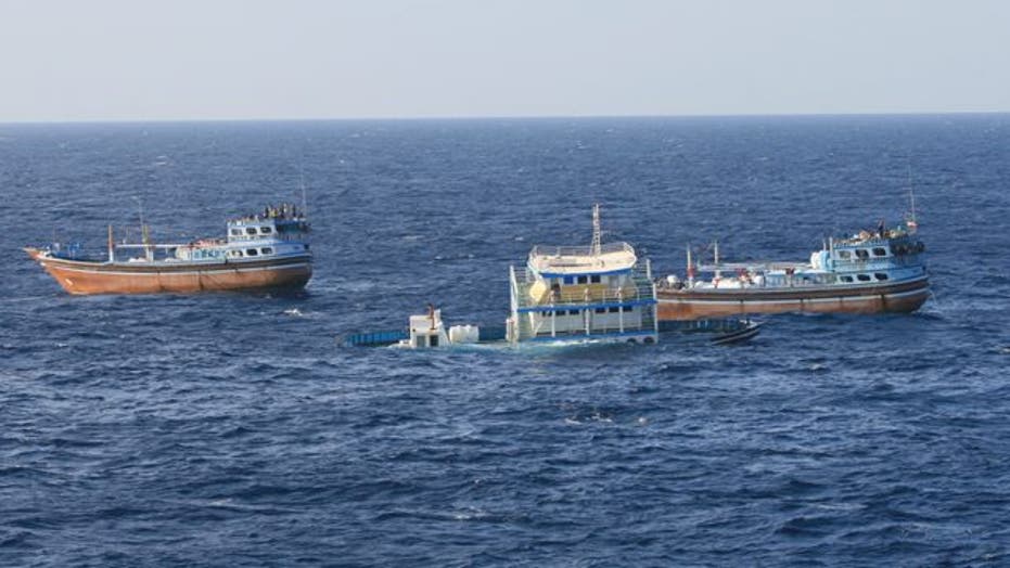 Navy ship aids sinking Iranian fishing dhow