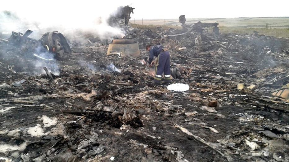 Warning: Graphic Content: Wreckage from Malaysia jetliner crash site in Ukraine